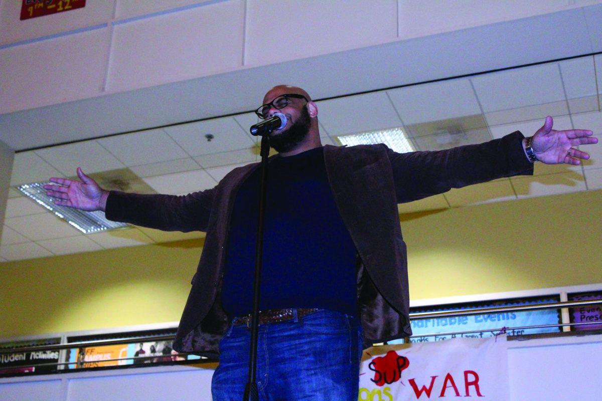 Clarence E. Wright performed Friday night in the Student Center Pit at the slam poetry competition. Wright was a guest for the Lyrical Allance -Assistant Photo Editor/Amanda Palma