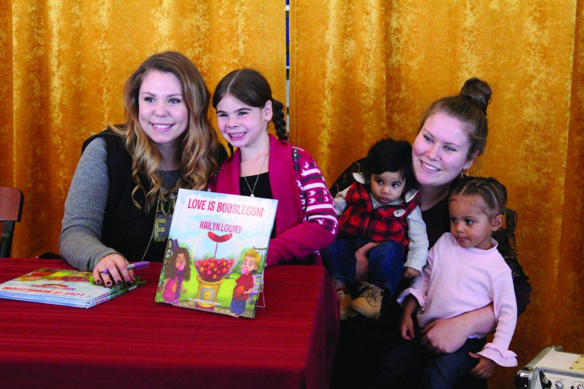 A young family gathers around Cailyn Lowry at her book signing this past Saturday at Barnes and Nobles. They stop to pose for a picture and an autograph with Cailyn's book: Bubble Gum is Love. -Amanda Palma/Assistant Photo Editor