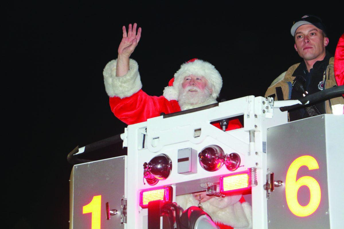 Santa arrives on the firetruck to light this year's Christmas Tree. -Justin Fata/Photo Editor