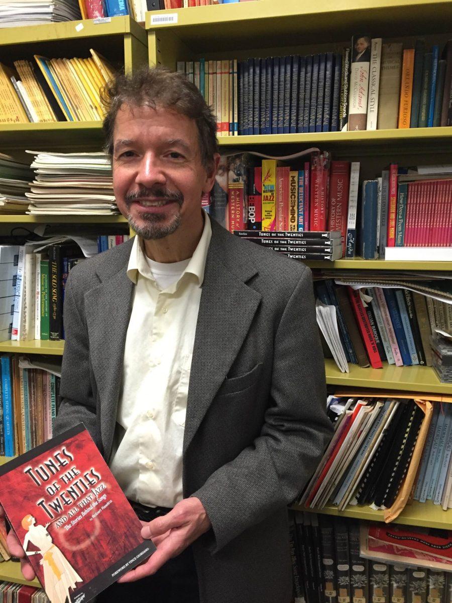 Rowan University Professor Robert Rawlins poses with his new book “Tunes of the Twenties.” -Photo courtesy of Robert Rawlins.