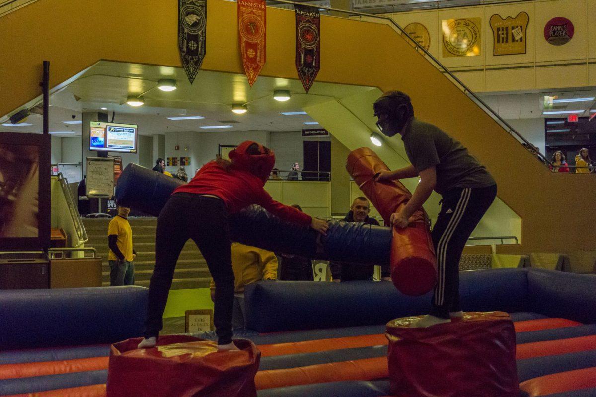 Students fight it out in the "jousting" arena in the Student Center Pit. This "Game of Thrones" novelty night brought a variety of themed activities to the Student Center. -Photo Editor/Cole Ditzel