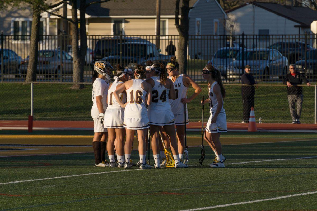 The Rowan women's lacrosse team huddles up during their game against No. 10 Catholic University on Wednesday. The Profs fell, 20-10, in the game. -Photo Editor/Cole Ditzel