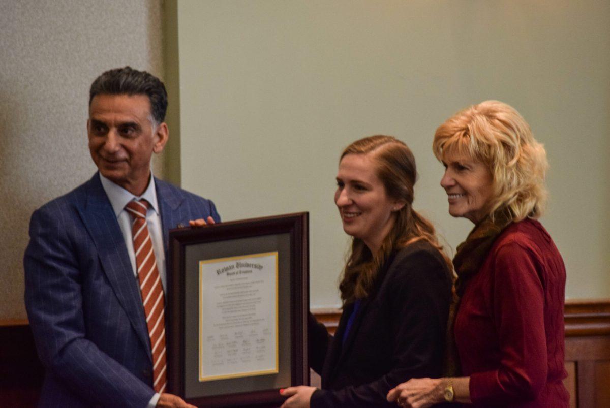 President Houshmand  presents student trustee, Melissa Shore with a certificate of accomplishment during the Board of Trustees meeting. -Staff Photo/Andrew Turco