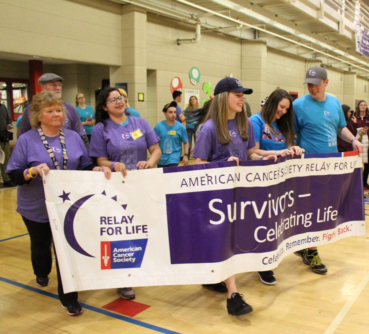 Participants walk around the REC Center Gym at Relay for Life. -Photo Editor/Amanda Palma 