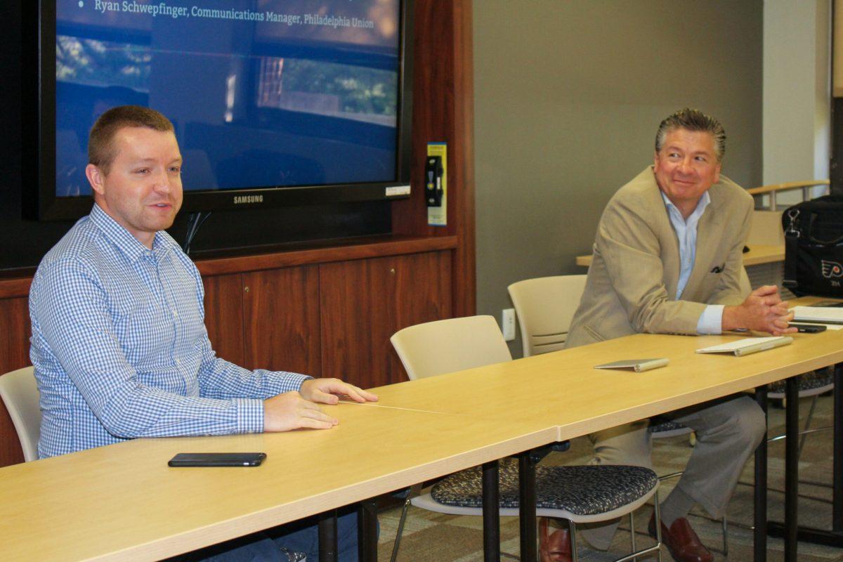 Ryan Schwepfinger (left) and Zach Hill answer questions from students at the PRSSA sports communication panel -Staff Photo/Matt Kass