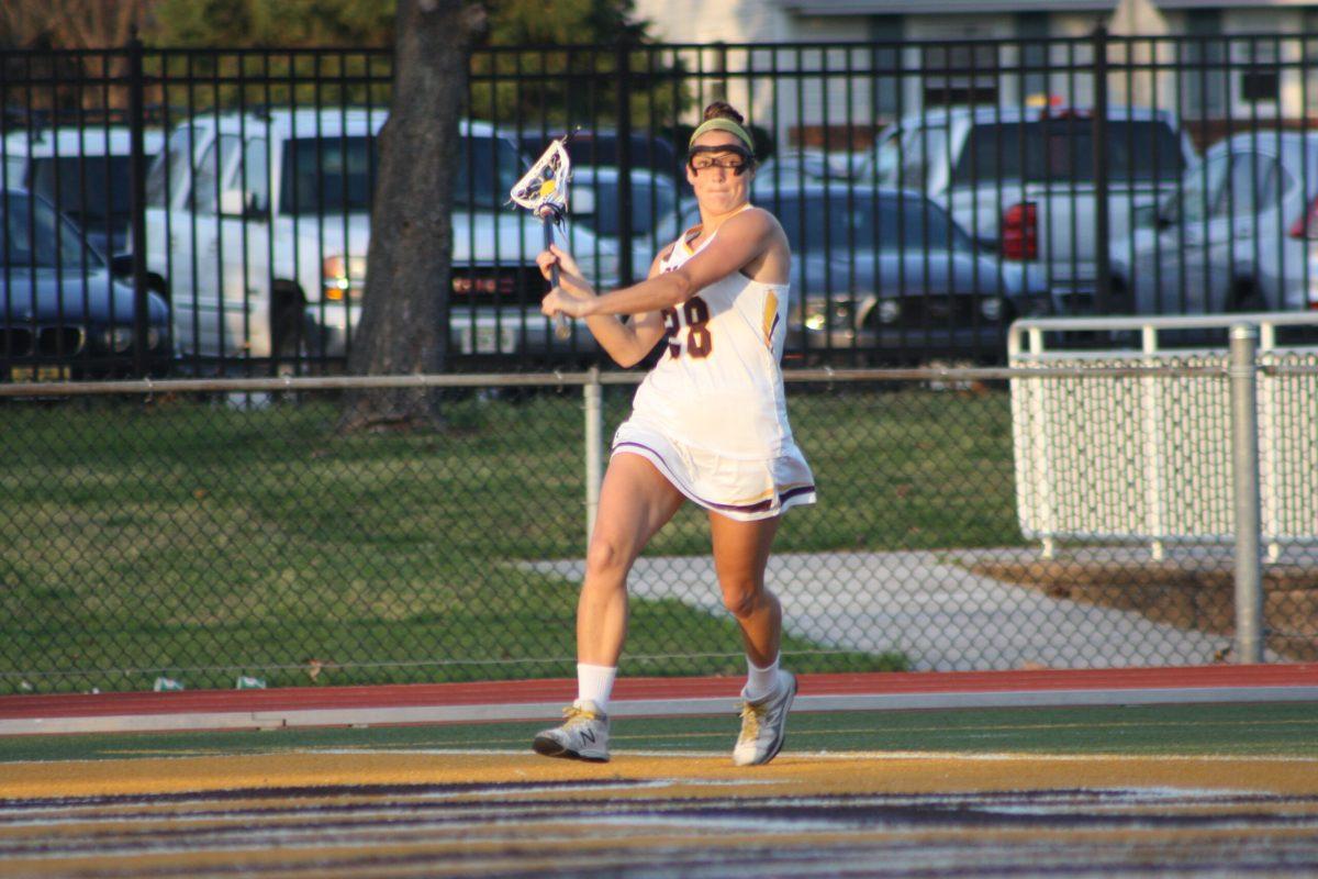 Sophomore midfielder Liz Kramer looks to make a play against Stockton University. Kramer had three goals in the 15-9 win. -Photo courtesy of Sports Information