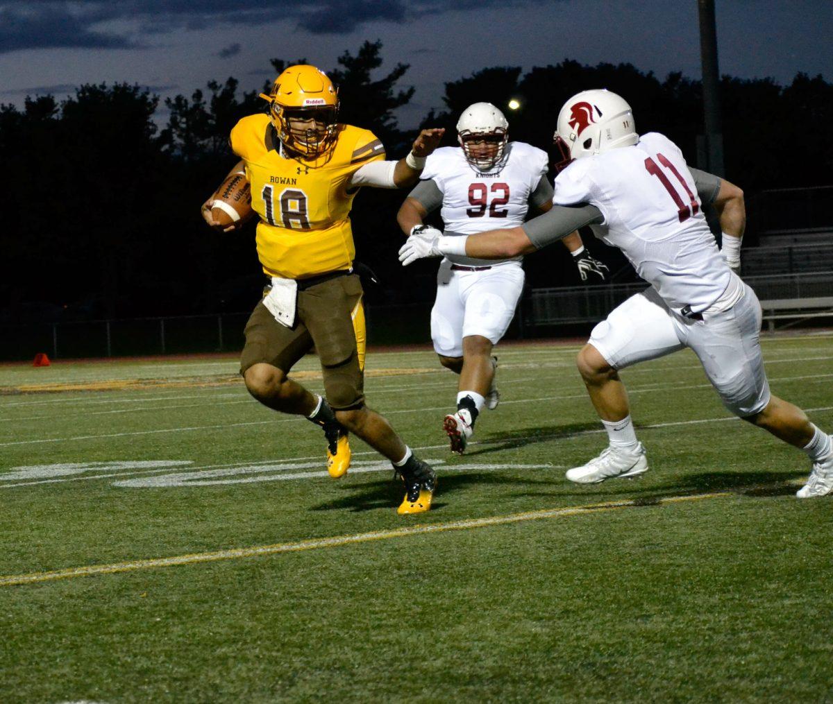 Sophomore quarterback Naldy Tavarez looks to avoid a defender last week in Rowan's home matchup against Southern Virginia University. The Profs return home this Saturday to face Frostburg State University. Photo Editor/Nicole Mingo