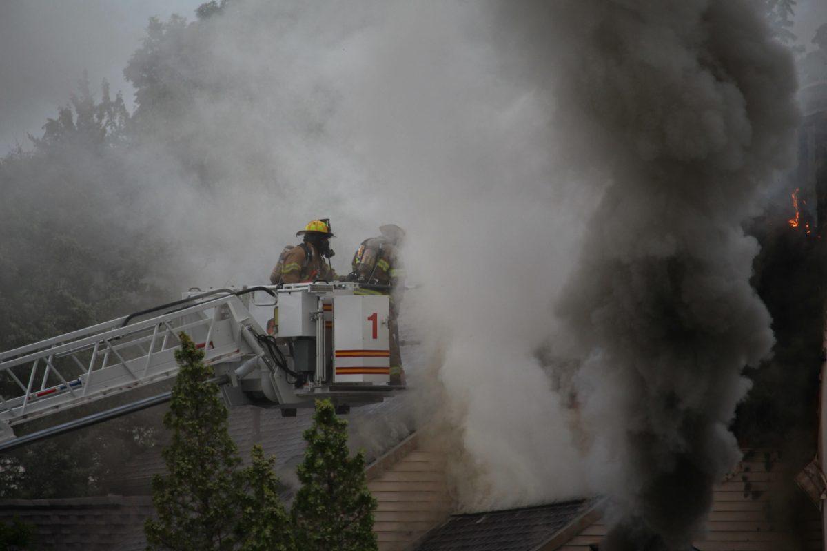 Firefighters work through billowing smoke to put out a house fire on the corner of Katherine Court and Christopher Lane on September 11, 2017.- Staff Photo/Jaryd Leady 