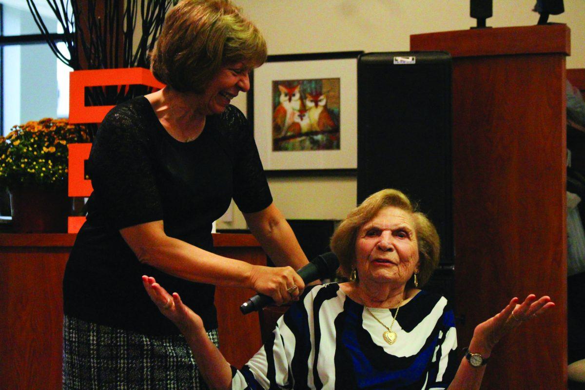 Judy Wizmur (left) and Terry Herskovits talk about Herskovits' experiences during the Holocaust. -Staff Photo/Maria Morales