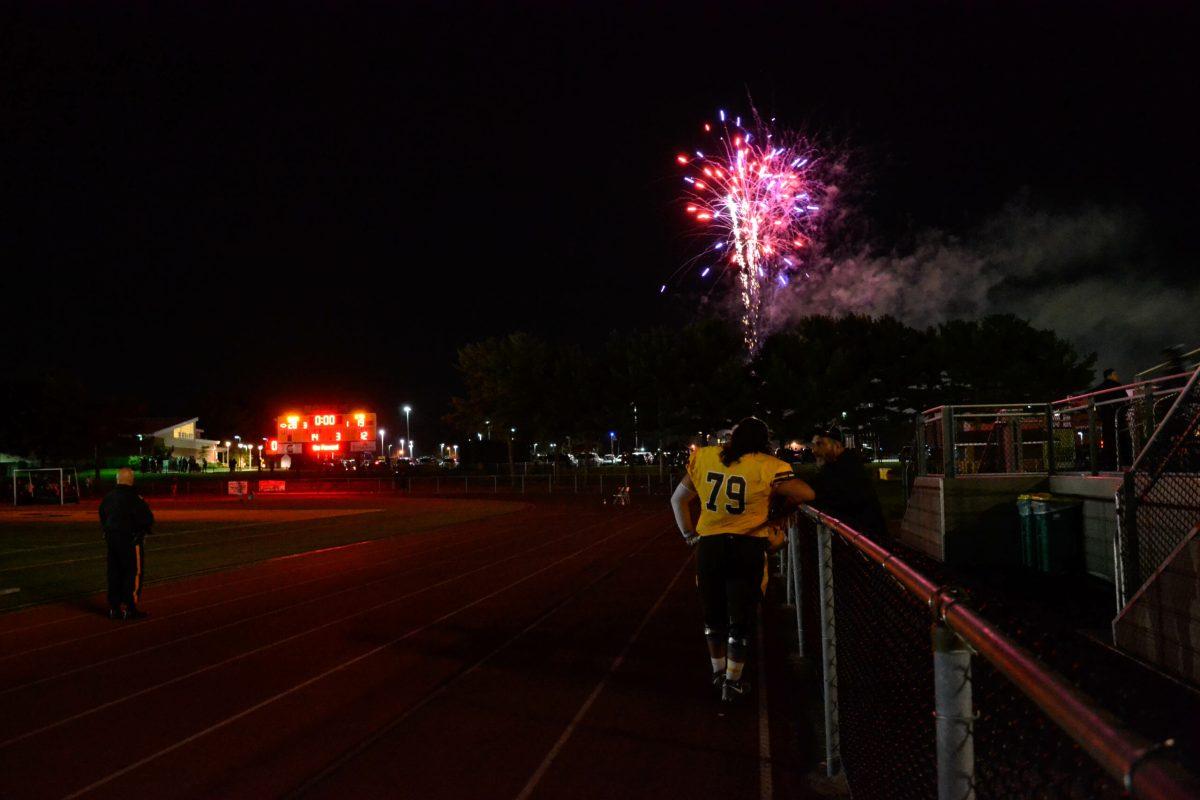 Sophomore offensive lineman Vito Nucci looks on at the firework display shown after Rowan's football game Saturday. The Profs would win, 28-19. Photo Editor/Nicole Mingo