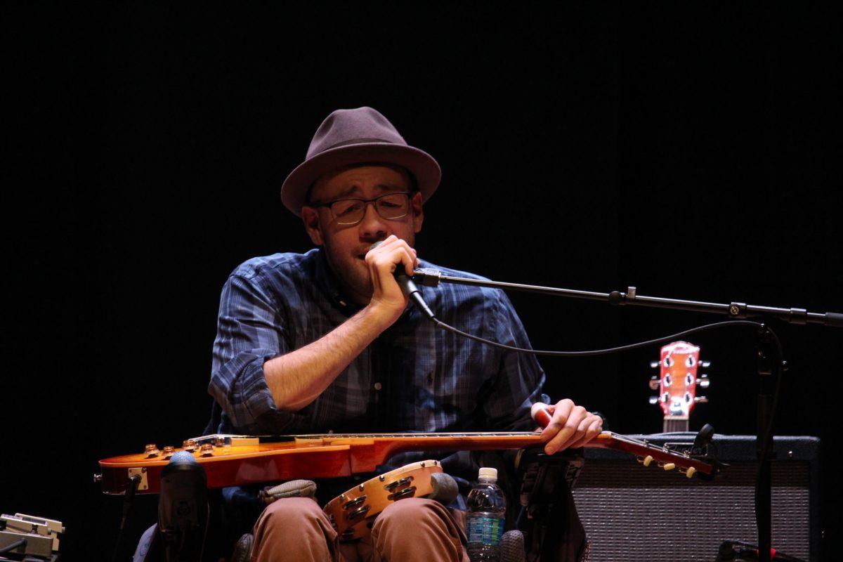 Ryan "Gooch" Nelson performs with slide guitar in lap. -Photo Editor/Amanda Palma