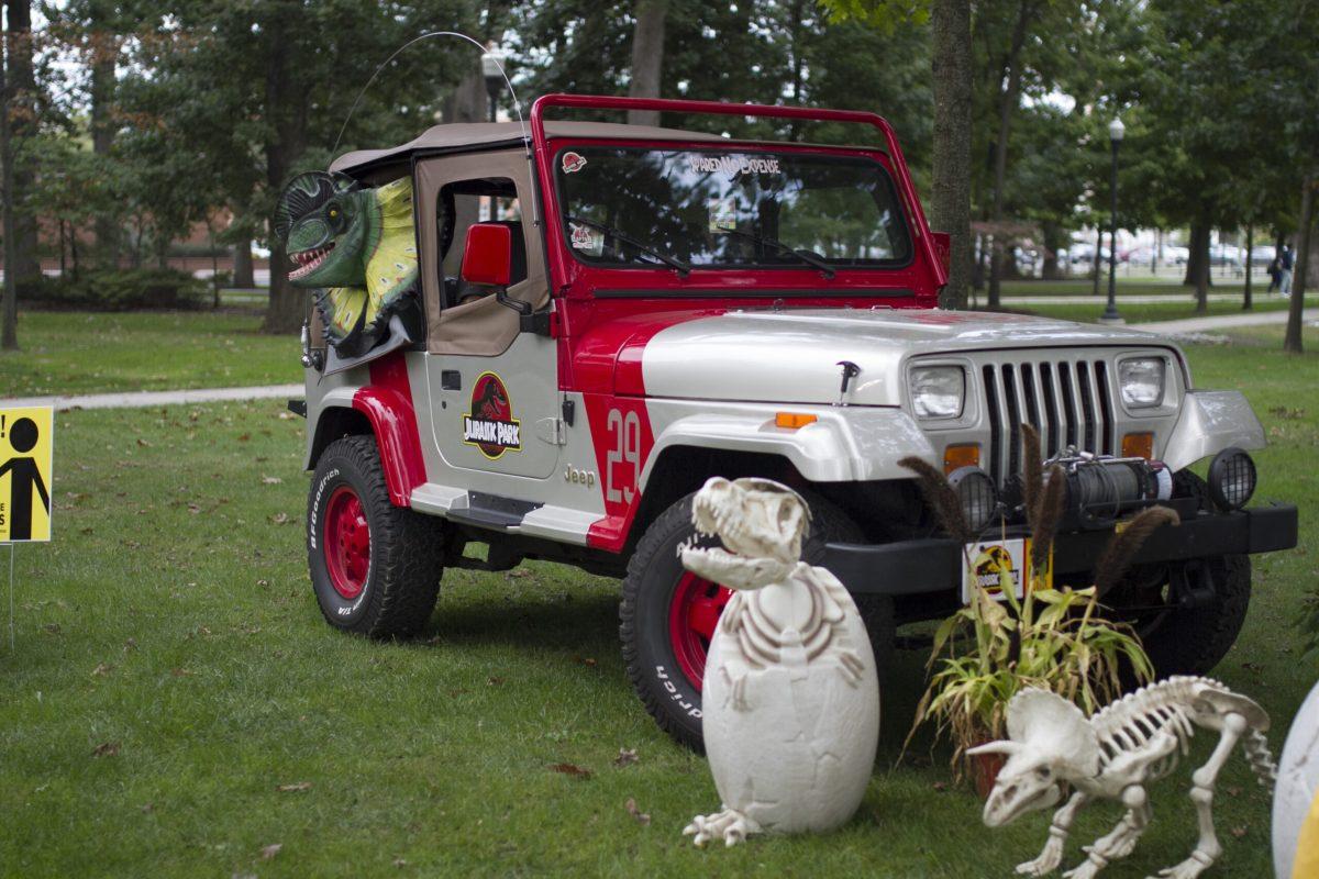 A Jurassic Park themed Jeep surrounded by fake dinosaur eggs and fossils. -Staff Photo/Miguel Martinez