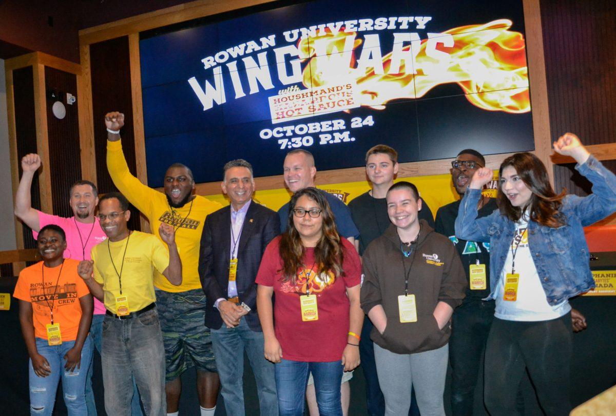 The 10 competitors pose with President Ali Houshmand before Rowan University’s Wing Wars at Chickie’s and Pete’s on October 24th, 2017. -Photo Editor/Nicole Mingo
