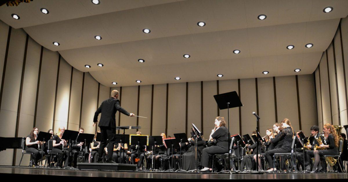 Rowan University Concert Band conductor Joseph Higgins conducts his band during the "Autumn Skies" concert. -Photo Editor/Nicole Mingo