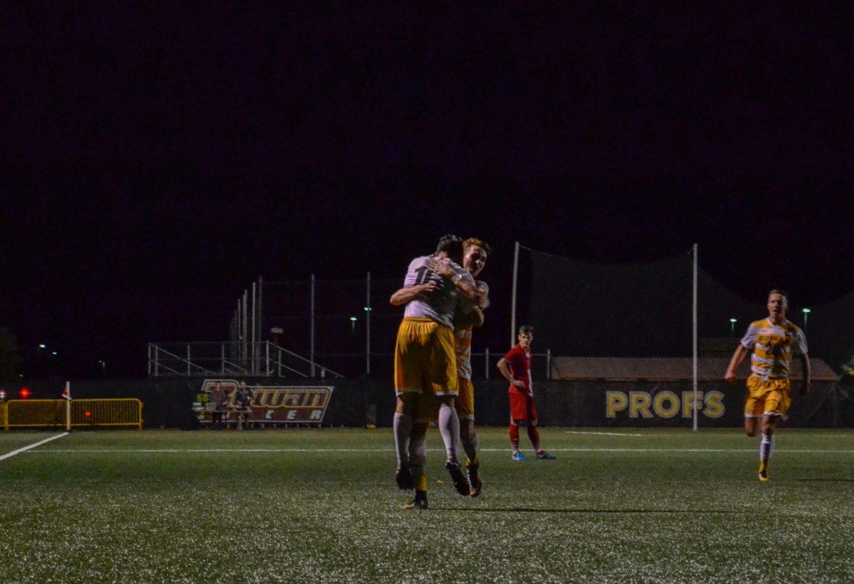 Junior midfielder Ryan Campbell celebrates with teammates in Rowan's 3-2 victory against Montclair State University on Saturday Night. Campbell netted his ninth goal of the season in the contest. Photo Editor/Nicole Mingo