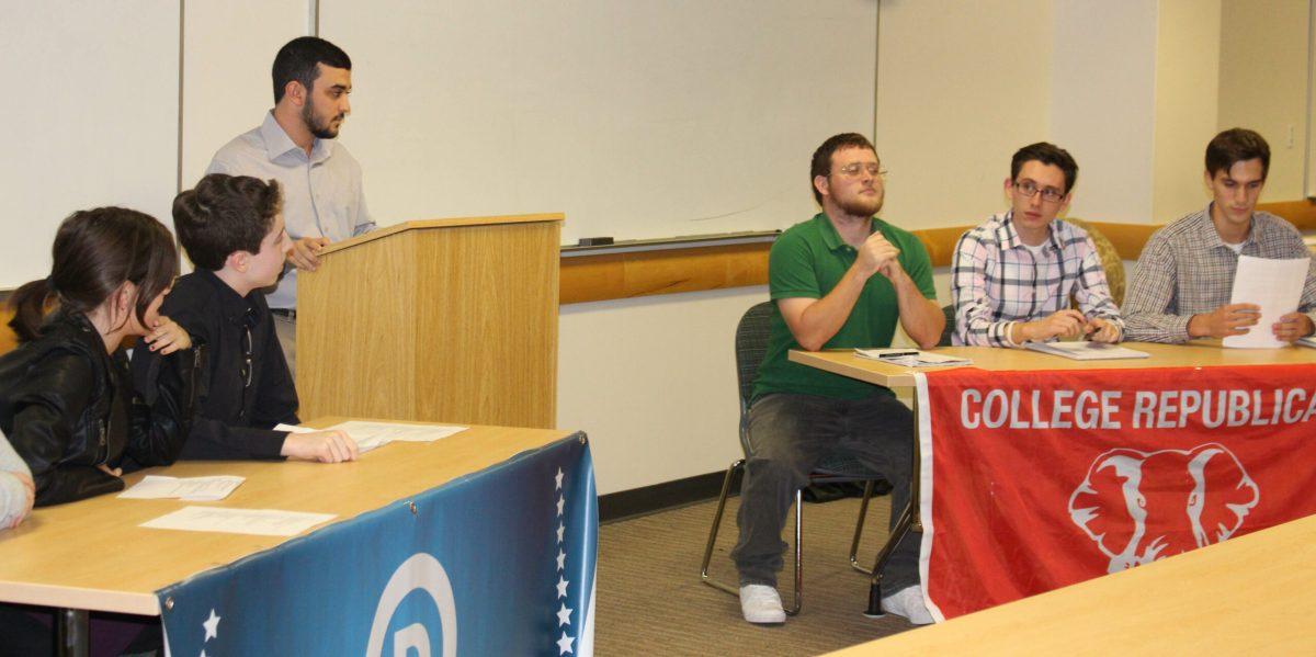 Members of the Democratic and Republican clubs look on during the debate. -Staff Photo/Sharelle Boyer