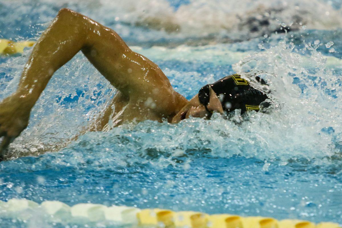 Senior captain Eric Feuerstein races in a meet earlier this season. Photo courtesy of Sports Information.