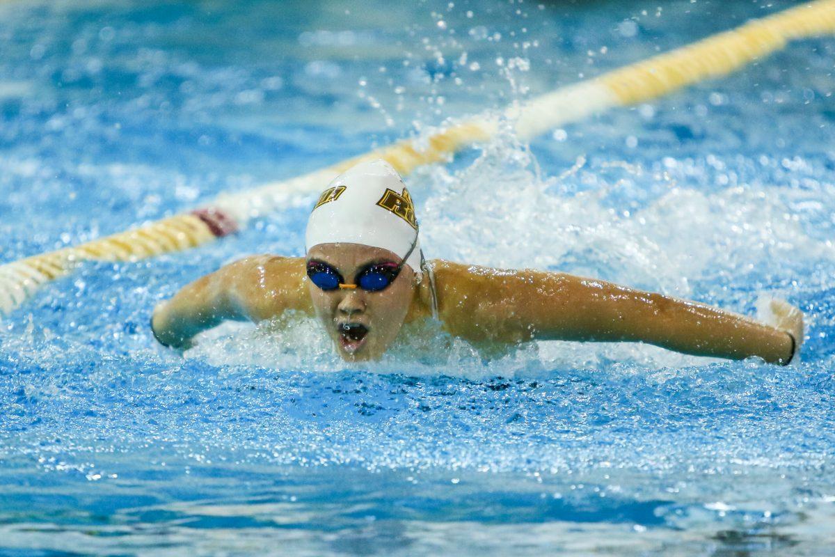 Junior Gabby Gligor during a race earlier this season. Gligor has set three personal records this season in the 50 backstroke 50 freestyle and 100 freestyle. Photo courtesy of Sports Information