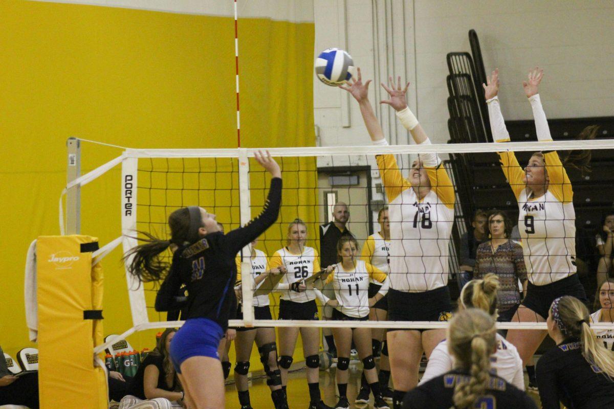 Juniors Jamie Shirtz and  Erin Keegan go up for a block earlier this year during the Profs Invitational. Photo Editor/Amanda Palma