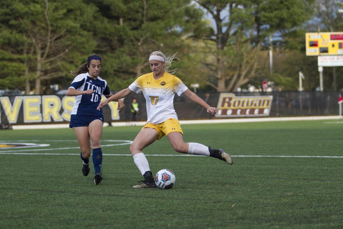 Sophomore back Casey Lubonski looks to go by a defender earlier this year against The College of New Jersey. Both men's and women's soccer teams will head to the NCAA Division III Championship Tournament. Assistant Photo Editor/Miguel Martinez