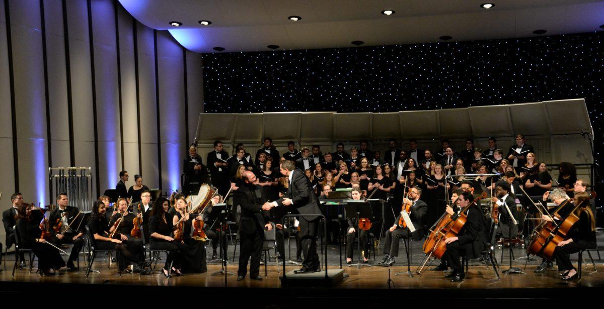 Guest tenor David Kellett (center left) shakes hands with Concert Choir conductor Christopher Thomas. -Photo Editor/Nicole Mingo