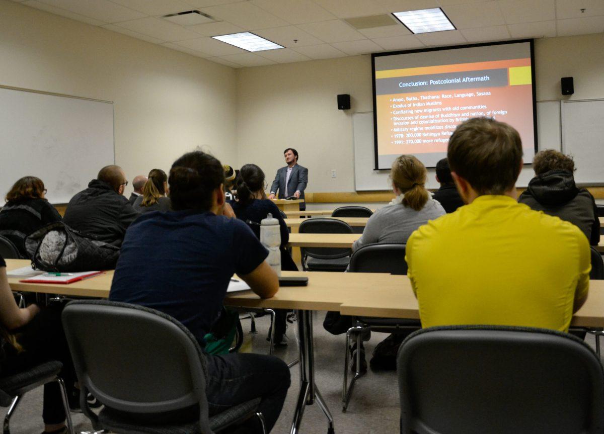 Visiting assistant professor in the department history, Dr. Joshua Gedacht, talks to students about where Islam is practiced in the world. - File Photo / Nicole Mingo
