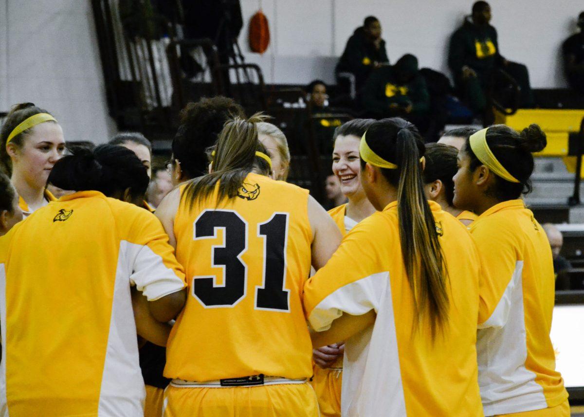 The Rowan women's basketball team shares a laugh in a huddle before a game earlier this year. The Profs are 10-6 overall and 7-3 in the NJAC. Photo Editor/Nicole Mingo