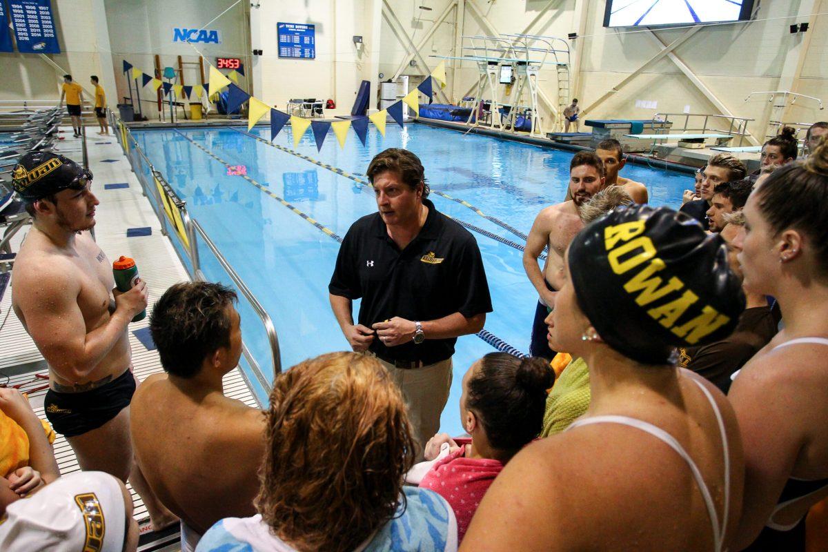 Rowan University men's and women's swimming and diving coach Brad Bowser talks to both teams earlier this year. Bowser has led the team's to NJAC titles this year. Photo courtesy of Sports Information. 