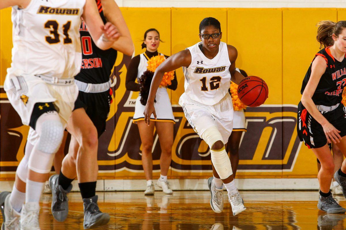 Sophomore guard Dominique Peters brings the ball up earlier this year against Montclair State University. Peters is averaging 14.3 points per-game. Photo courtesy of Sports Information. 