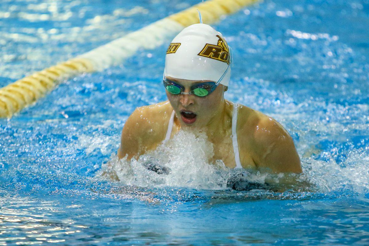 Freshman Emily Kopchick swims in an event earlier this season. She was part of the 400 medley relay that came in second during this past weekend's tri-meet. - Photo courtesy of Sports Information. 