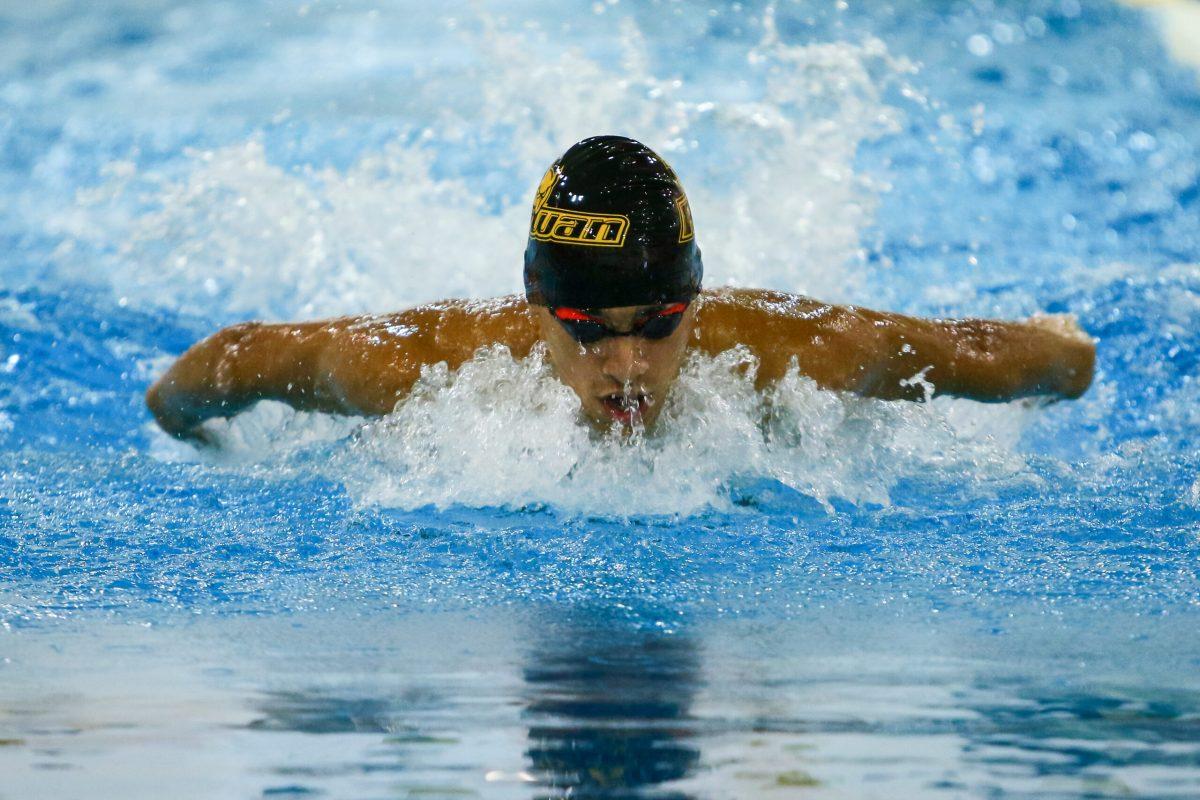 Freshman Youssef Elshenawy swims in a meet earlier this season. Elshenawy won in the 200 butterfly and 400 individual medley this past weekend in the tri-meet. Photo courtesy of Sports Information. 