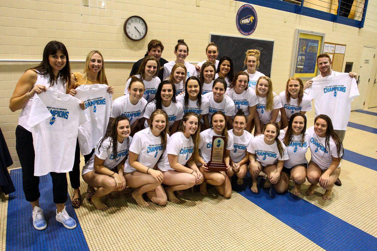 The Rowan women's swimming and diving team celebrates their NJAC title after defeating TCNJ. Photo courtesy of Sports Information. 