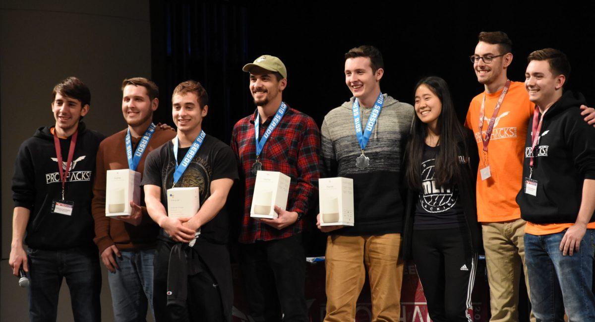 First place winners ParkingPi pose for a photograph onsatge at the third annual ProfHacks event on Feb. 25, 2018. -Photo Editor/Nicole Mingo