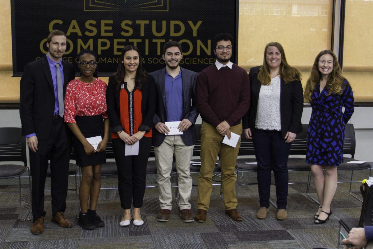 The winning group poses for a photo during the Case Study Competition hosted by the College of Humanities and Social Sciences on Friday, Feb. 23, in the Student Center. -Photo courtesy of Will Mendez
