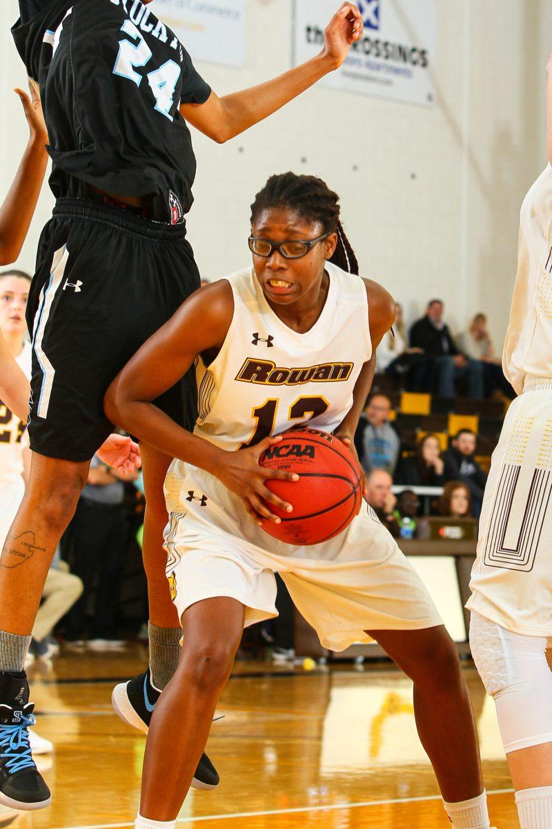 Rowan's Dominique Peters takes on a Stockton University defender earlier this season. Photo courtesy of Sports Information