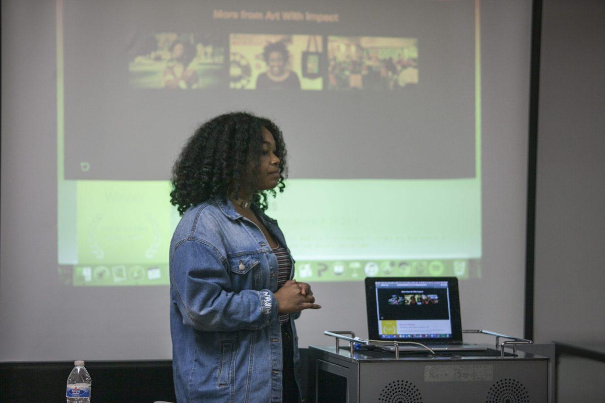 Senior psychology major Iniah Corbitt leads the "Art With Impact" discussion on Tuesday, Feb. 20, 2018 in the Chamberlain Student Center. Assistant Photo Editor/Miguel Martinez 