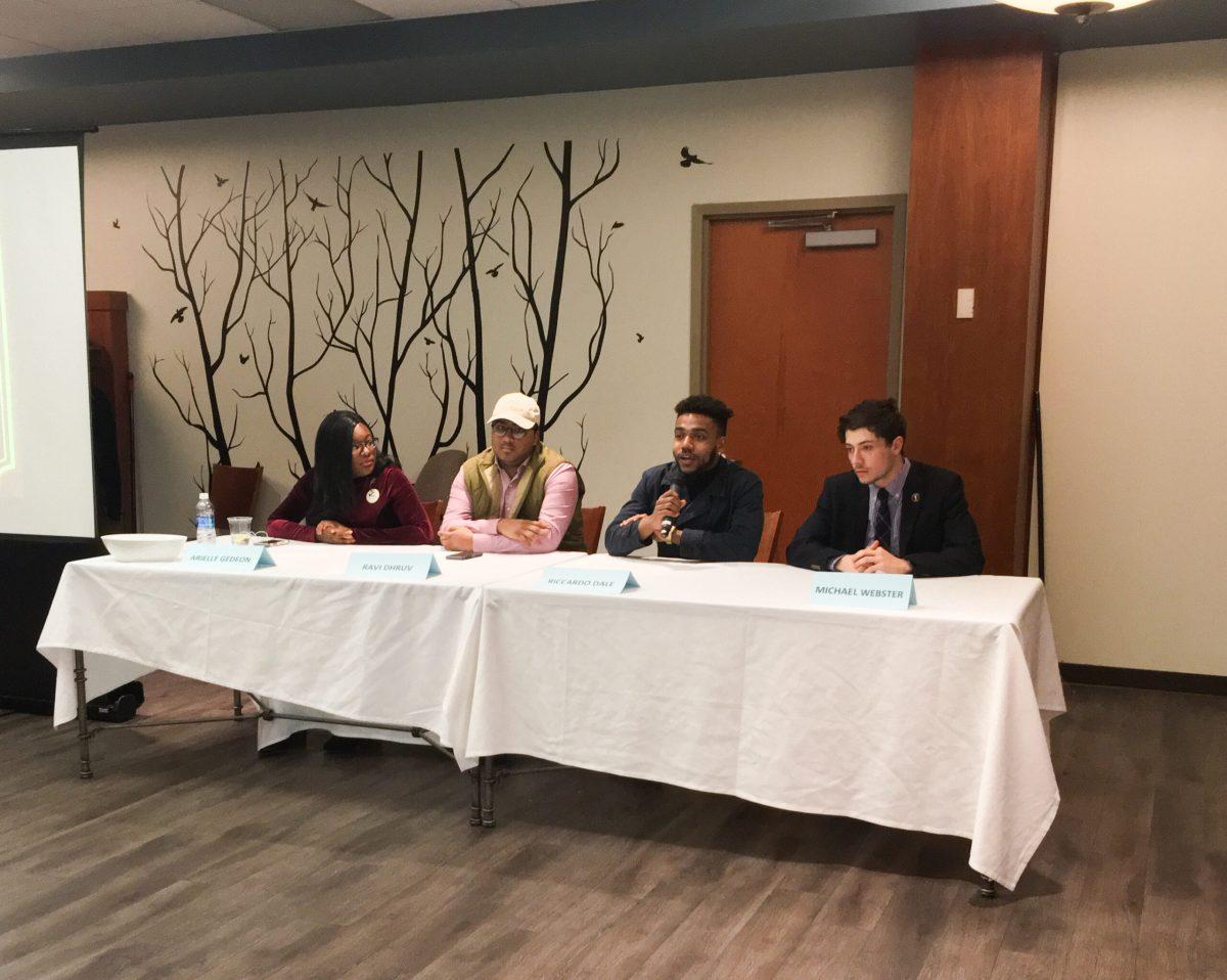 The candidates sit at the table and field questions from the audience. -News Editor/Matt Kass