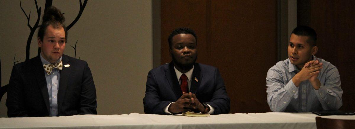 SGA presidential candidates Joe Egan, Rbrey Singleton and Gino Wetherholt sit at the main table during meet the candidates night on March 1, 2018. -Photo Editor/Amanda Palma