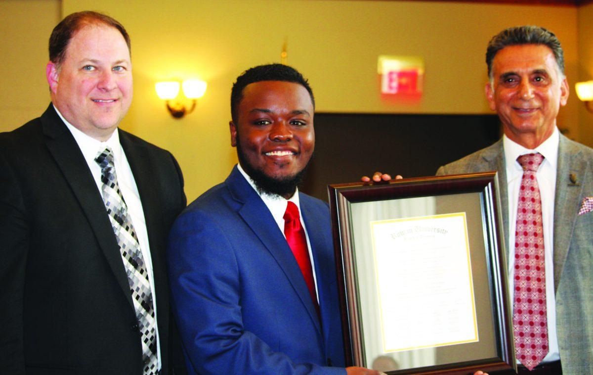 (L to R) Chairman Chad Bruner, Rbrey Singleton and President Ali pose for a photo at the Board of Trustees meeting. -News Editor/Matt Kass 