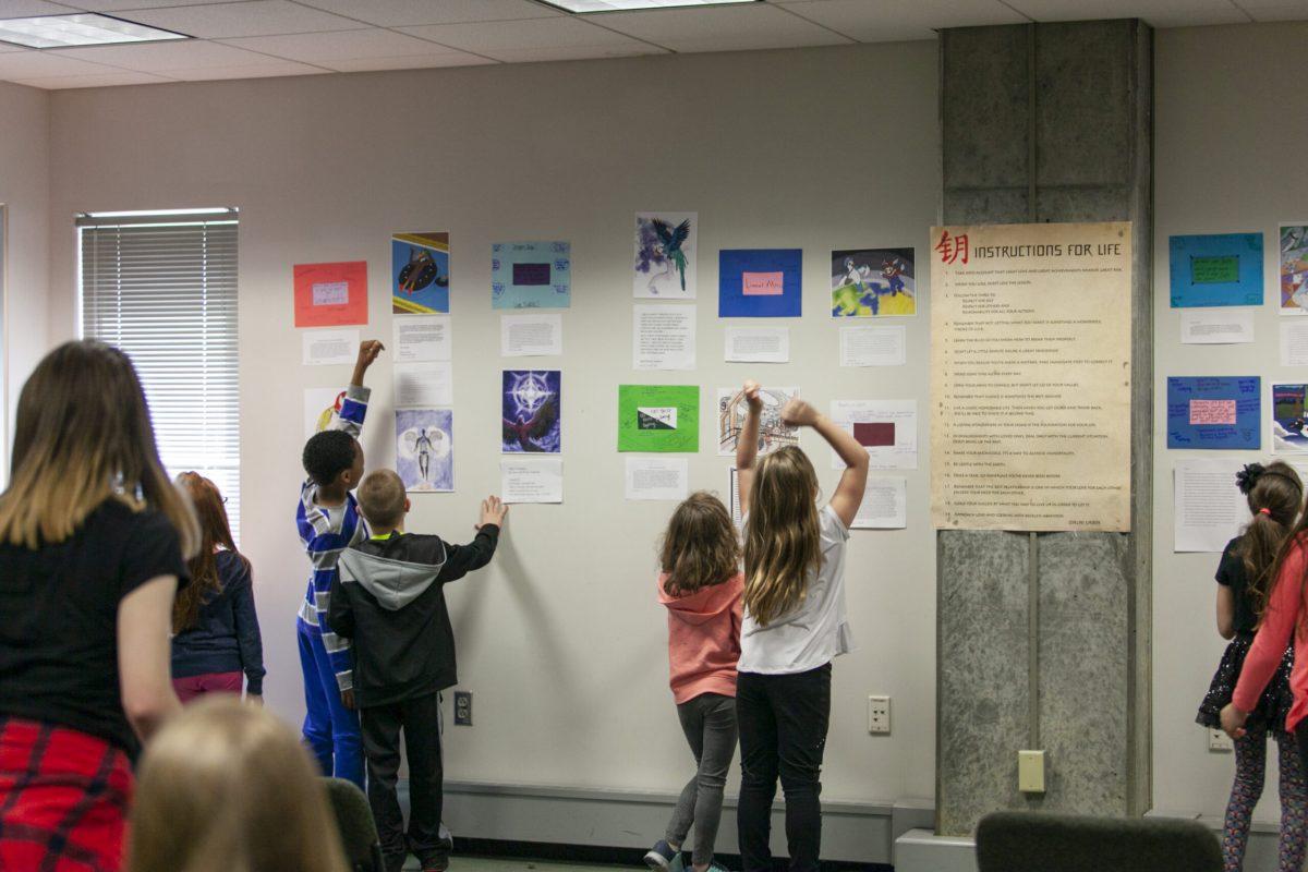 Students admire their hard work at the Rowan Writing Center on April 24, 2018. -Assistant Photo Editor/Miguel Martinez