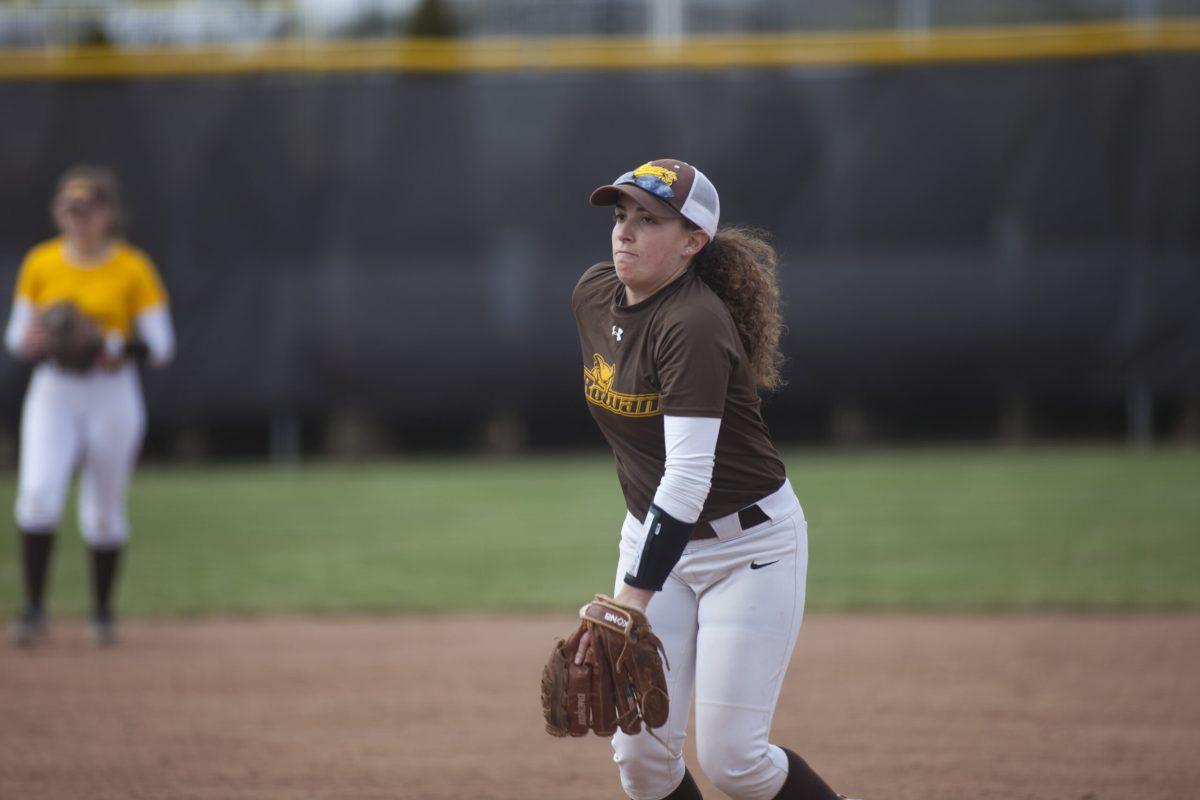 Freshman pitcher and outfielder Nina Rizzo winds up for a pitch during Wednesday's practice. -Assistant Photo Editor/Miguel Martinez