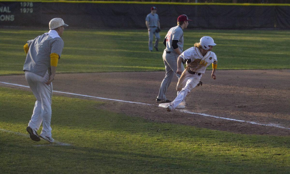 Junior outfielder Dan Shane rounds third base towards home plate in a game earlier this year. Assistant Photo Editor/Miguel Martinez