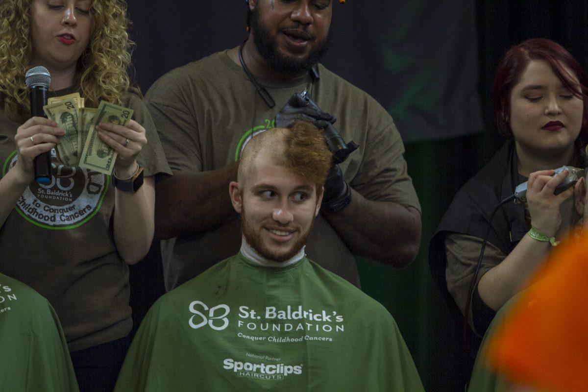 A participant getting his head shaved during Saint Baldrick's Day on April 7, 2018. - Staff Photo / Miguel Martinez