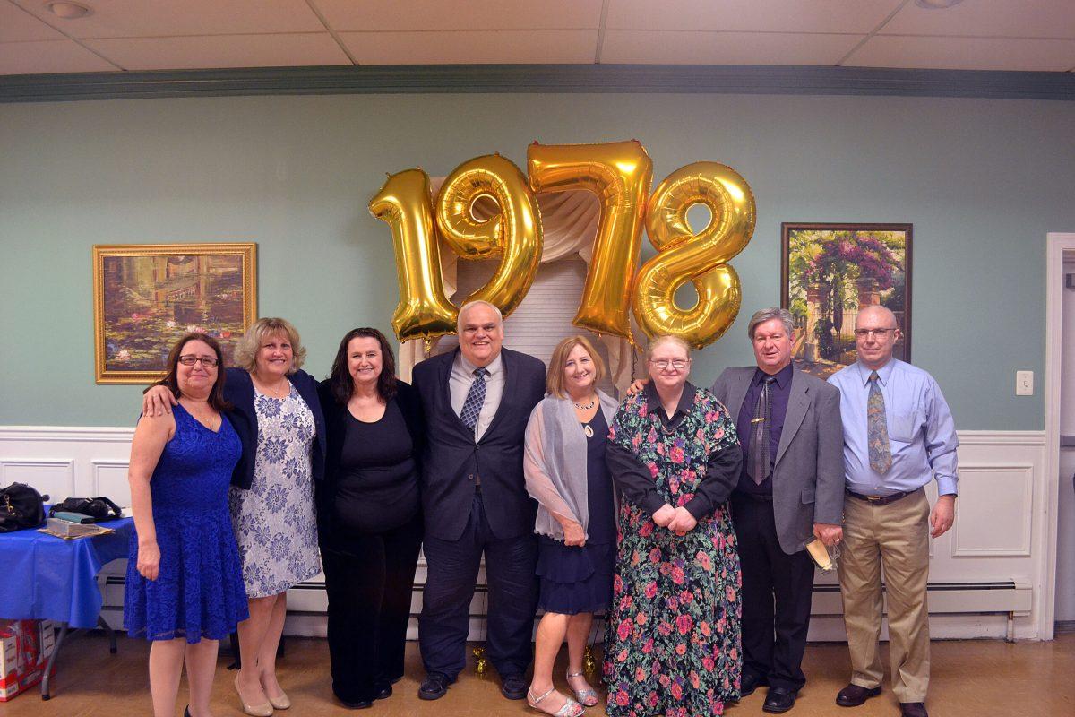 (L to R) Leah Rubinstein Cinman, Jill Delin Marsh, Patty Roda Lutz, Rick LaFever, Anita Rose, Ann Taussig LaFever, Joel D. Gordon and John Zenuk, the original members of the Rowan EMS squad pose for a photo at the banquet on April 13, 2018. -Assistant News Editor/Mackenzie Fitchett