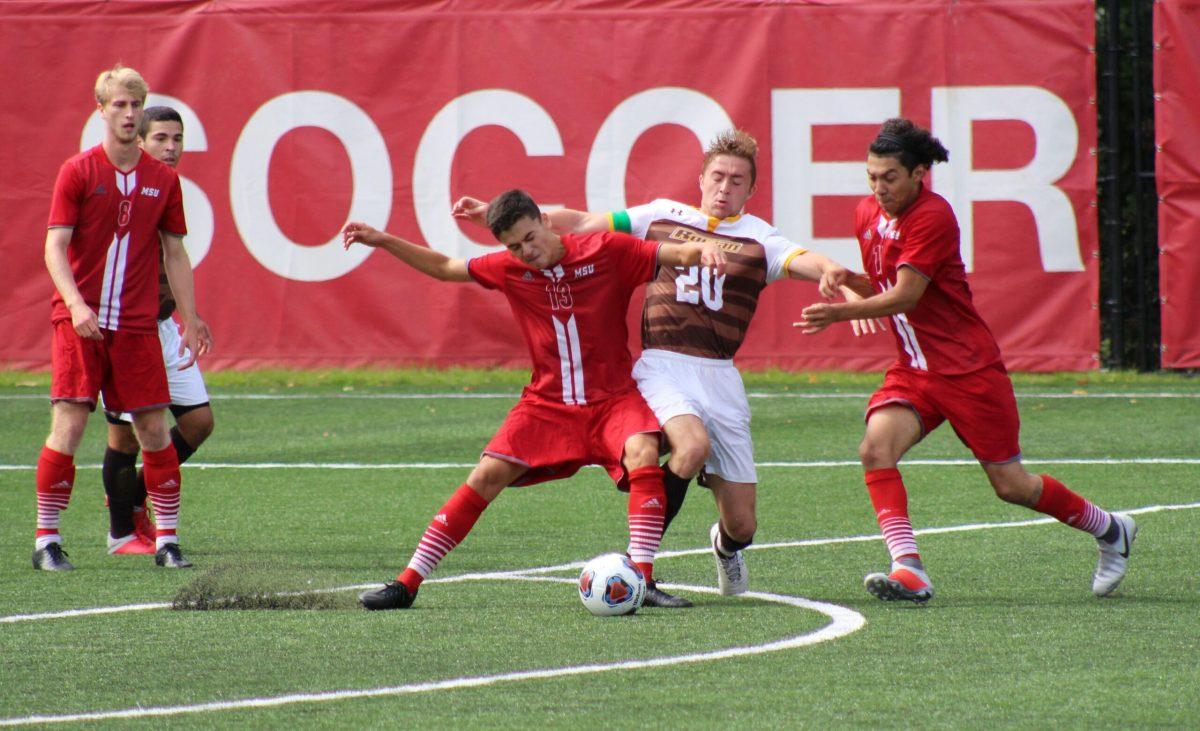 Freshman midfielder Aaron Robertson and Montclair freshman midfielder Anthony Pelaez fight for possession. Photo courtesy of Anthony Gabbianelli of The Montclarion. 