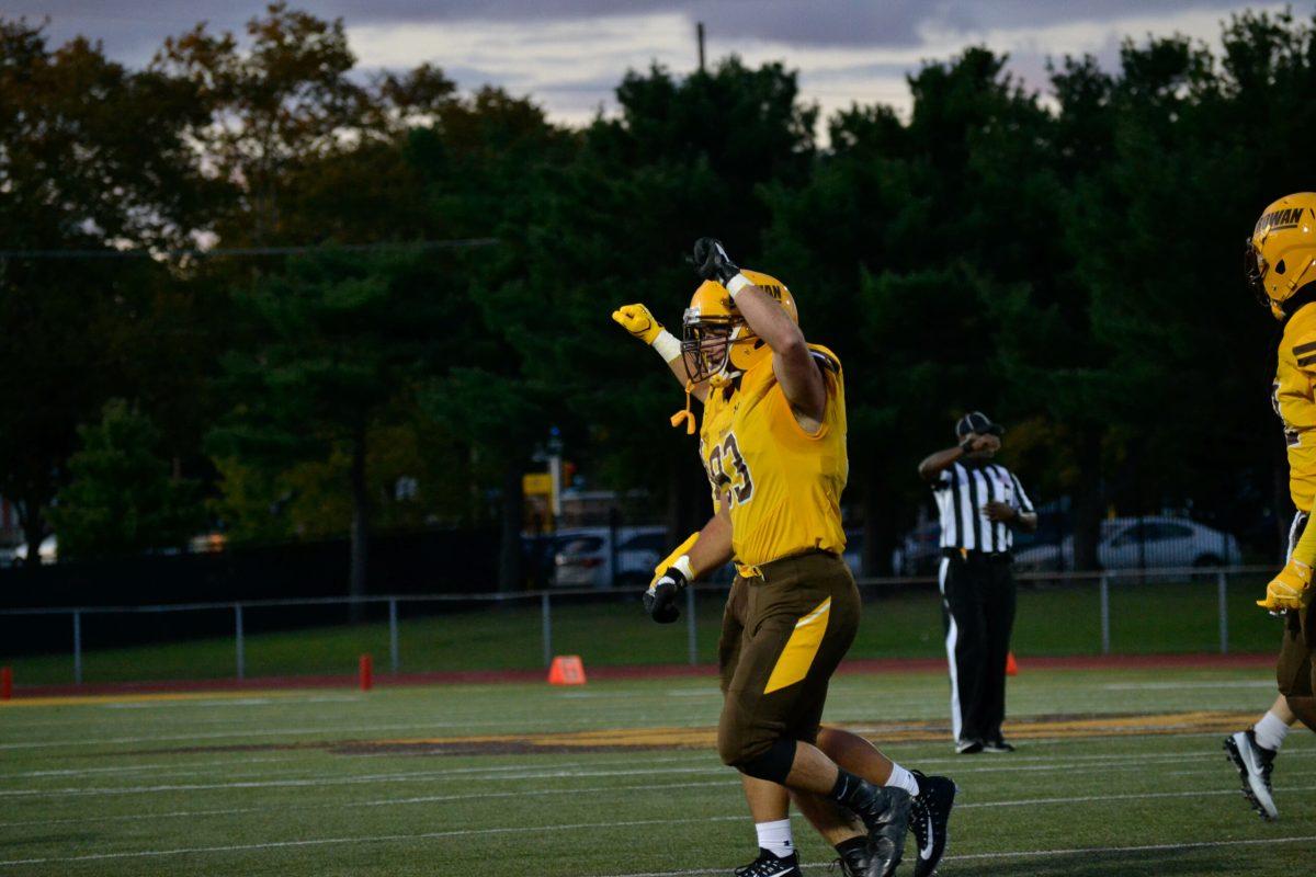 Sophomore Tom Reid leads the Profs off the field last year against Southern Virginia University.  Rowan defeated SVU 20-17 this past weekend to move to 2-0 on the season. Photo courtesy of Nicole Mingo