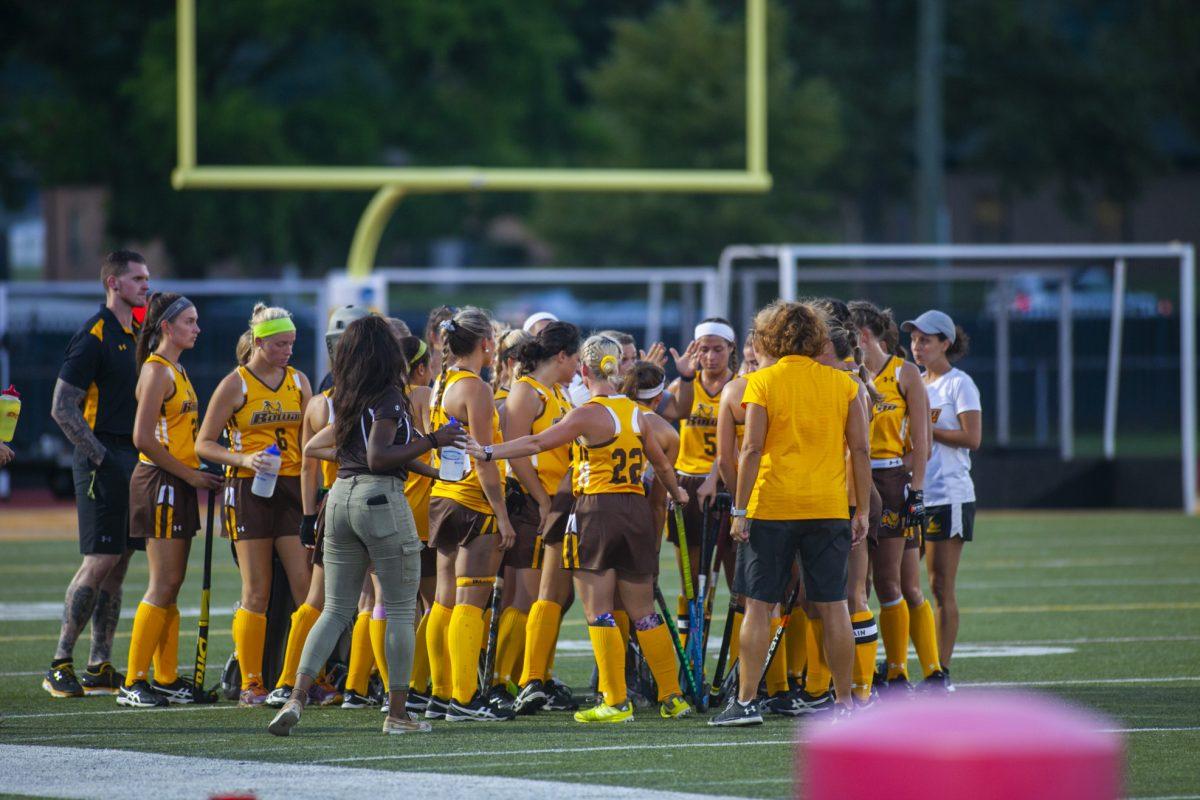 The Rowan field hockey team huddles up during a game at Coach Richard Wackar Stadium. The stadium will be host the Division III NCAA Field Hockey Championship in 2024. Photo / Miguel Martinez