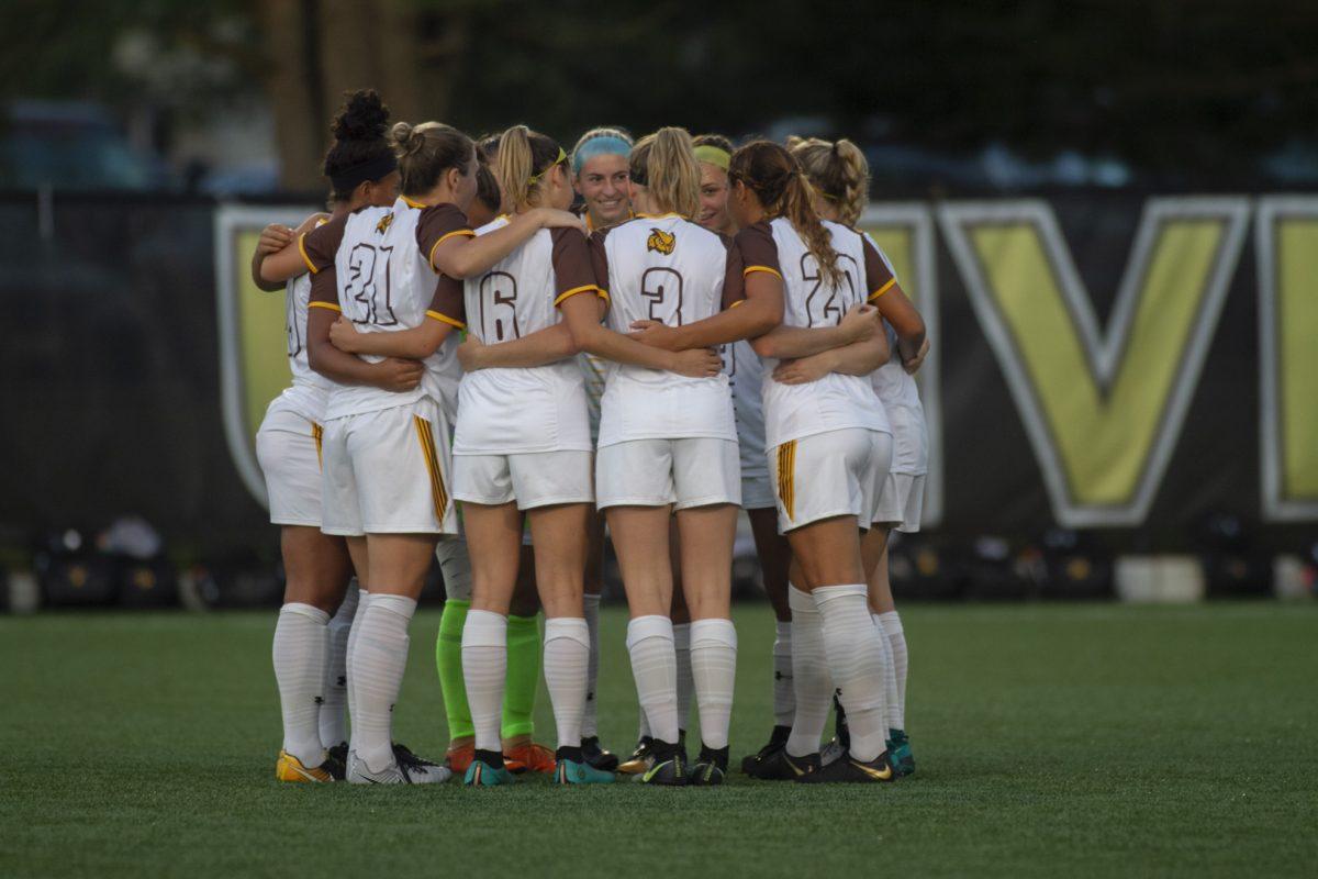 The women's soccer team huddles up before their game last week against Marymount University. Multimedia Editor/Miguel Martinez