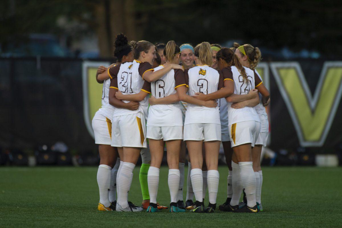 The Rowan women's soccer team huddles up on the field before their game against Marymount University. Multimedia Editor/Miguel Martinez 