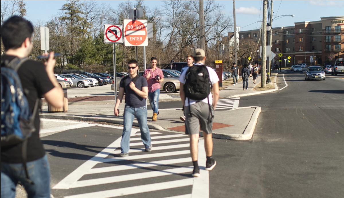 Students walking down Route 322. -Multimedia editor/Miguel Martinez